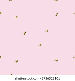 Seamless pattern with small golden crowns on soft pink background