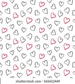 Seamless pattern with small hearts in black and pink colors. Design for Saint Valentine's Day Cards. Hand drawn hearts isolated on the white background.