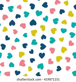 Seamless pattern with small hearts of fresh colors on a white background. Vector repeating texture.