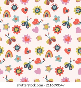 Seamless pattern with small multicolored flowers, hearts, butterflies, rainbows, sun. Retro 60s, 70s design for gift wrap, textile, home decor. Love, Valentines Day concept