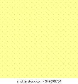 Seamless pattern in a small point. In the style of polka dot on a light mustard yellow background.