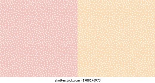 Seamless pattern of small random polka dots in pink and yellow variations.
