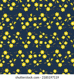 Seamless pattern of small simple yellow flowers and bouquets on a dark blue background. Design for cotton fabric, wallpaper, home textile.