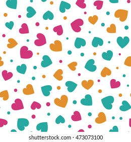 Seamless pattern with small spring colored hearts and dots on a white background. Vector repeating texture.