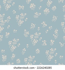 Seamless pattern with small, tiny wildflowers on a light background.