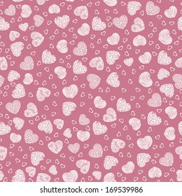 Seamless pattern with small white hearts on a pink background