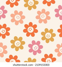 Seamless pattern with smiling daisies