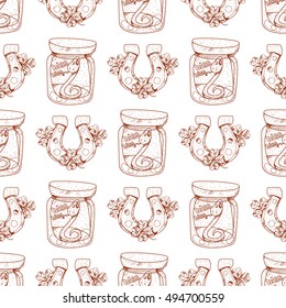 Seamless pattern with a snake in a glass jar and a horseshoe