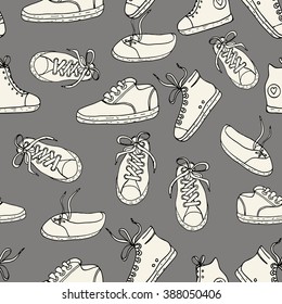 Seamless pattern with sneakers. Vector background.