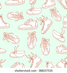 Seamless pattern with sneakers. Vector background.