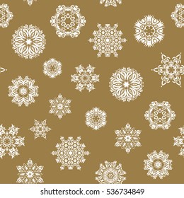 Seamless pattern. Snow flakes background. Snowflake vector design on beige background.