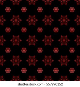 Seamless pattern. Snow flakes background. Snowflake vector design in red and orange colors.