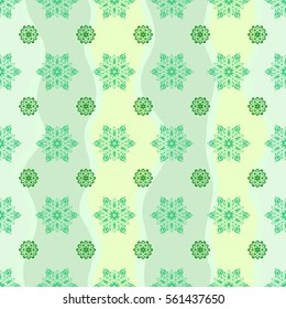 Seamless pattern. Snow flakes background. Snowflake vector design in green colors.