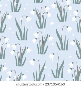 Seamless pattern with Snowdrops flower and snowflakes on light blue background. Vector Illustration.