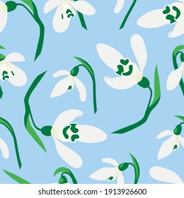Patrón sin mar con gotas de nieve sobre un suave fondo azul. Fondo floral primaveral para textil, tela, papel pintado, embalaje y scrapbooking. 