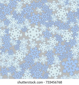 Seamless pattern. Snowflakes are arranged in random order.