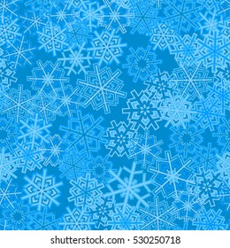 Seamless pattern of snowflakes. Blue background.