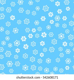 Seamless pattern of snowflakes. Blue background.