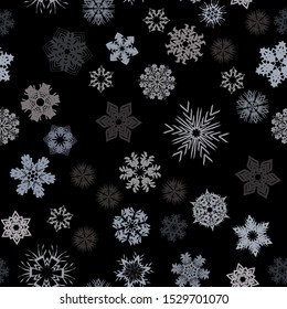 Seamless pattern. Snowflakes. Blue chaos. Black background. Editable.