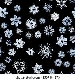 Seamless pattern. Snowflakes. Blue chaos. Black background. Editable.