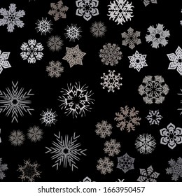 Seamless pattern. Snowflakes. Blue chaos. Black background. Editable.
