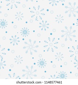 Seamless pattern of snowflakes and dots, blue on white