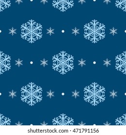 Seamless pattern of snowflakes and dots, in blue colors
