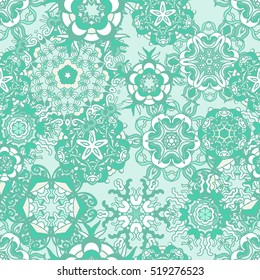 Seamless pattern with snowflakes mint color