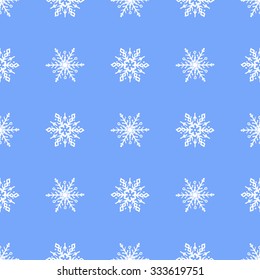 Seamless pattern snowflakes on a beautiful blue background