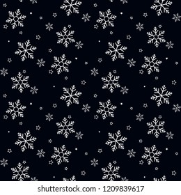 Seamless pattern of snowflakes on a black background