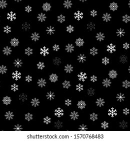 Seamless pattern of snowflakes on a black background