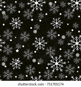 Seamless pattern of snowflakes on a black background.Snow falls background. Symbol winter, Merry Christmas holiday, Happy New Year celebration Vector illustration