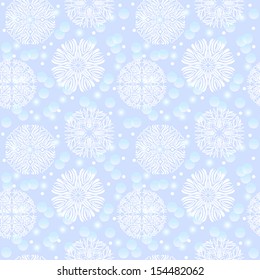Seamless pattern with snowflakes on a blue background