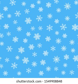Seamless pattern with snowflakes on a blue background