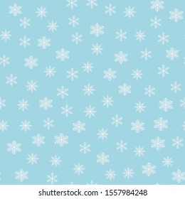 Seamless pattern with snowflakes on blue background