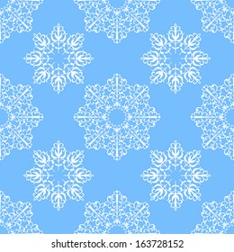 Seamless pattern with snowflakes on a blue background