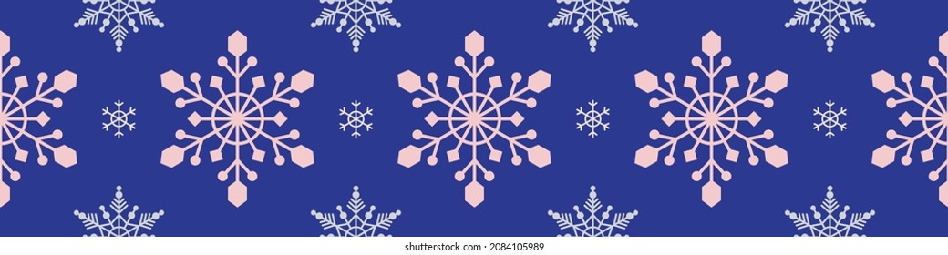 Nahtloses Muster mit Schneeflocken auf blauem Hintergrund