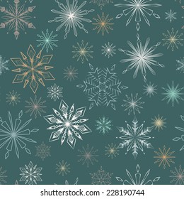 Seamless pattern of  snowflakes on a blue background