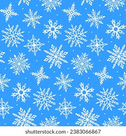 Seamless pattern with snowflakes on a blue background.