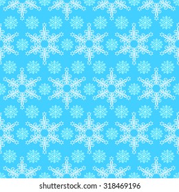 Seamless pattern from snowflakes on a  blue background