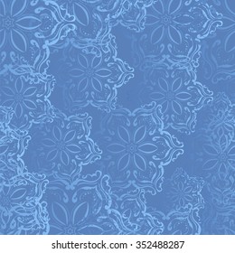 Seamless pattern of snowflakes on a blue background.