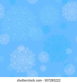Seamless pattern of snowflakes on a blue background
