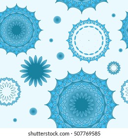 Seamless pattern of snowflakes on a blue background