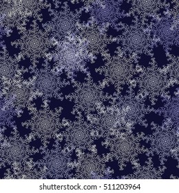 Seamless pattern of snowflakes on a blue background