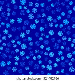 Seamless pattern of snowflakes on a blue background.