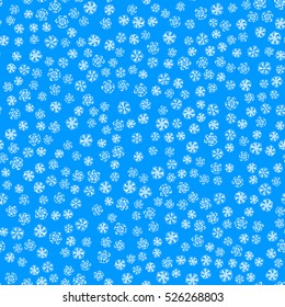 Seamless pattern of snowflakes on a blue background.