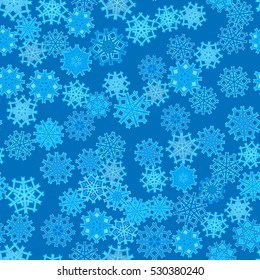 Seamless pattern of snowflakes on a blue background.