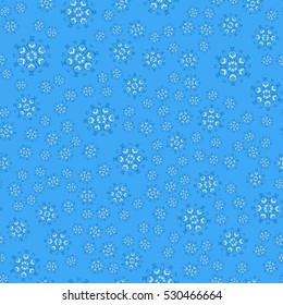 Seamless pattern of snowflakes on a blue background.