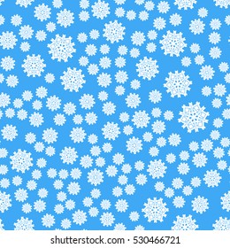 Seamless pattern of snowflakes on a blue background.
