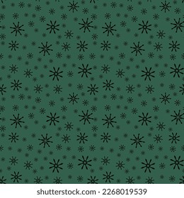 seamless pattern of snowflakes on a green background
